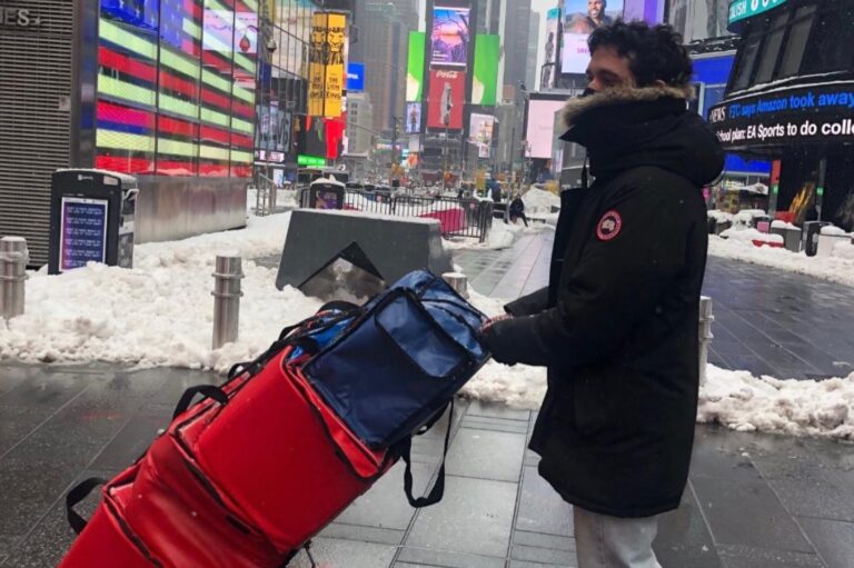 Encore team member delivering meals